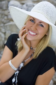 A sophisticated and beautiful young woman laughing and happy