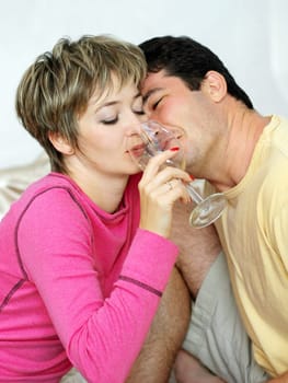Young couple with a glass of wine.