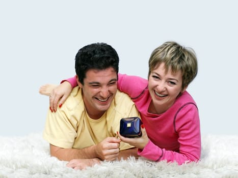 Young couple lying on the rug