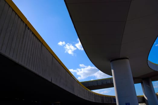 sky glimpsed between motorway flyovers/expressway overpasses