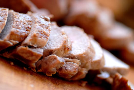porc cooked on a wood piece