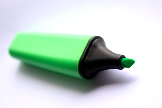 Green Highlighter on a white paper background.
