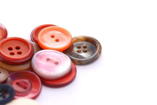 colored sewing buttons on a white background