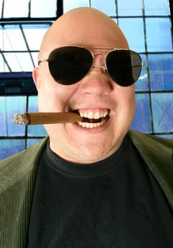 Looking up at The Kingpin, Boss, Head Honcho, Top Dog...  An image of the Man in charge, smoking a cigar in his factory office setting.  Harsh lighting for more disturbing look.