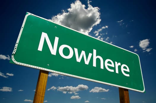 Nowhere Road Sign with dramatic blue sky and clouds.
