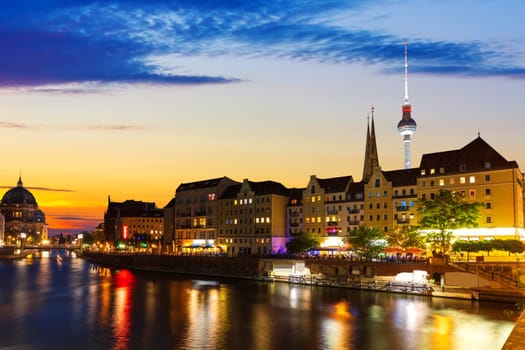 River Spree and the downtown buildings of Berlin, evening lights view, Germany.