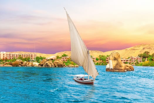 Famous sailboat and the Nile River scenery, sunset view, Aswan, Egypt .