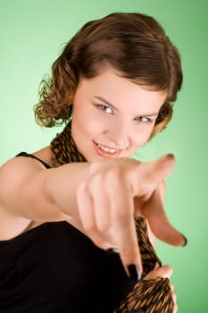 a glamorous girl in the evening dress pointing her finger