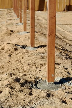 Freshly Installed Fence Posts in new neighborhood.