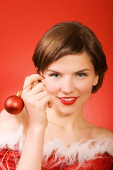 a  christmas girl over the red background