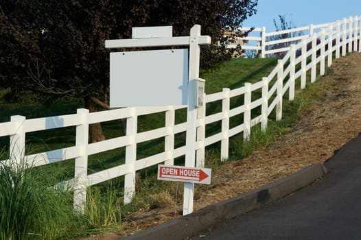 Blank Real Estate Sign along a country road with Mini Open House Arrow Sign.