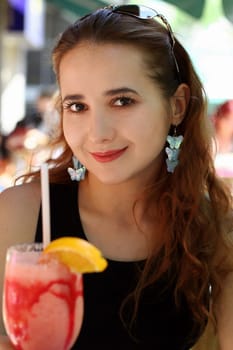 Young woman with a drink