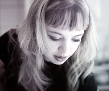 Blond girl looking down  Shallow DOF