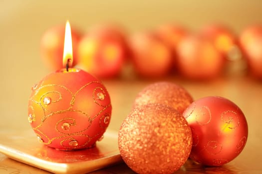 Beautiful Christmas candles in golden tone