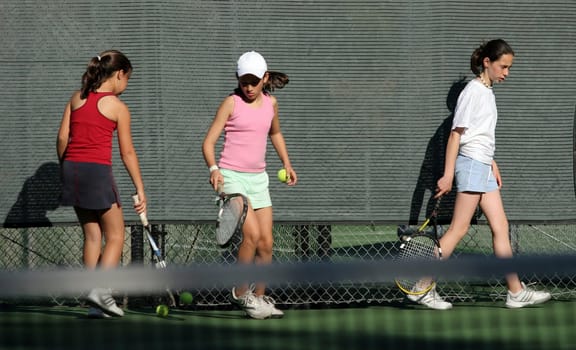 3 girls at tennis practice