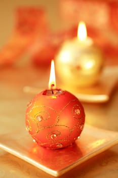 Beautiful Christmas candles in golden tone