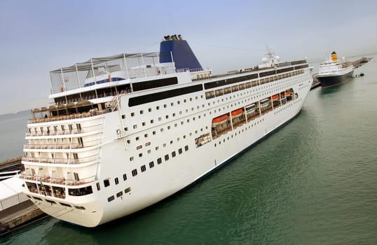Luxury cruise liner docked at pier