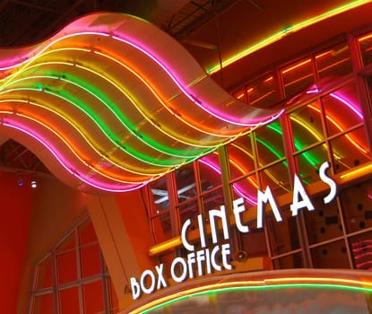 Colorful neon lights of cinema sign