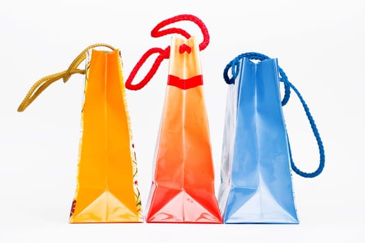 Christmas colorful paper bags on white
