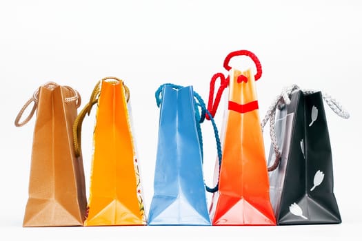 Christmas colorful paper bags on white