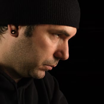 A suspicious male portrait - burglar, prowler, thief.