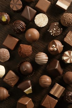Delicious background of dark, milk, and white chocolate pralines.