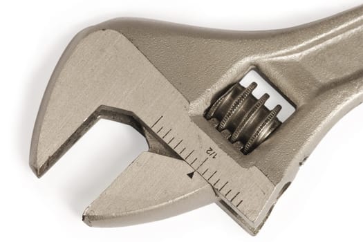 Macro image of the jaws of an adjustable wrench.