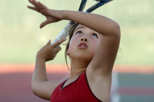 Cute girl playing tennis