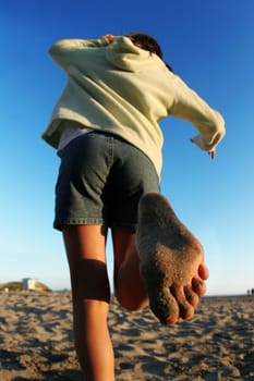 Girl running on the beach