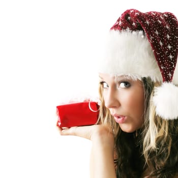 winter portrait of a beautiful young smiling woman with a gift in her hands