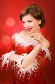 a christmas girl dressed in the red fur coat