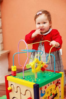 Portrait of cute baby with toys