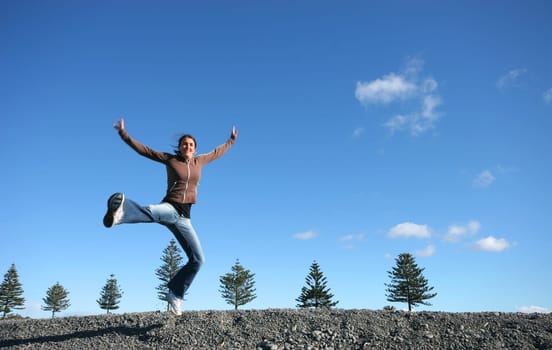 Woman jumping in the morning
