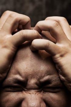close up photo of a man having great painful stress and depression