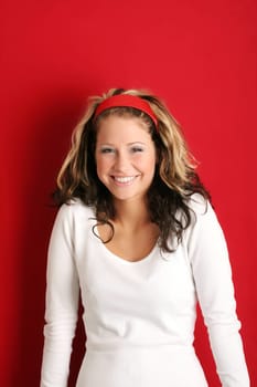 A young, attractive and happy woman is smiling