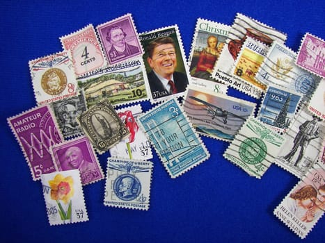 USA stamp collection on blue background.