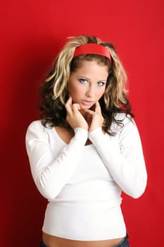 A young, attractive and unhappy woman is looking sadly