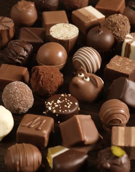 Delicious background of dark, milk, and white chocolate pralines.