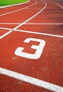 number three of a racetrack, on red tarmac, for runners.
