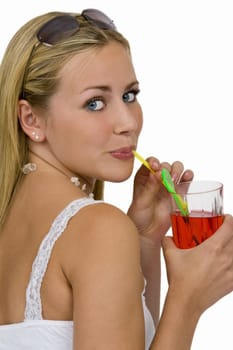 Isolated studio shot of a beautiful young woman drinking a bright red drink through a straw