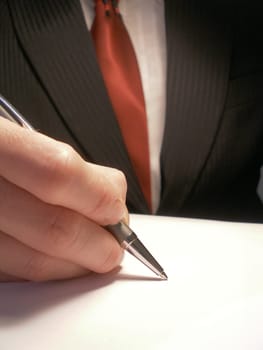 business man signing or writing