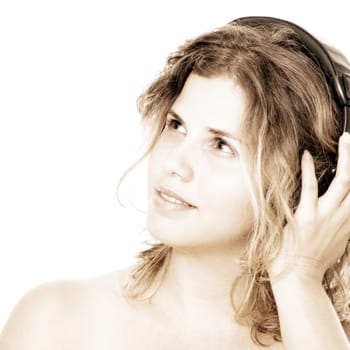 Young blond woman with headphones listening to music - isolated