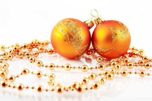Christmas balls and ribbon on white background