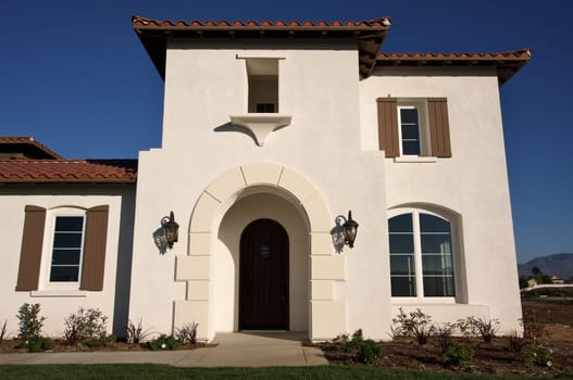 Abstract of newly constructed, modern home facade.
