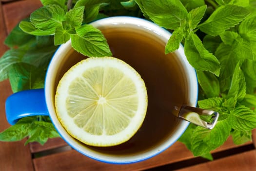mint tea with lemon and fresh peppermint leaves.
