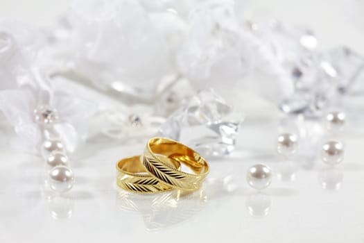 Wedding still life with beautiful golden rings