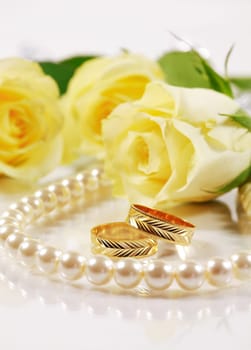 Wedding still life with beautiful golden rings