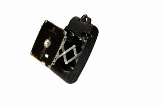 Antique collapsible camera isolated on white.