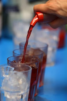 Drinks being poured at a bar