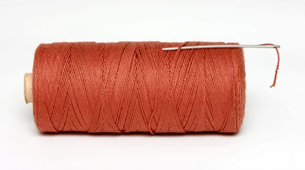 Needle and thread, isolated on white